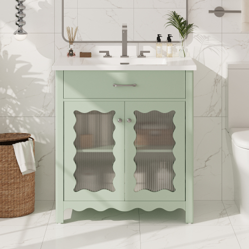 Mueble de baño moderno de 31 pulgadas, vidrio templado, patas de madera, puertas suaves, verde.