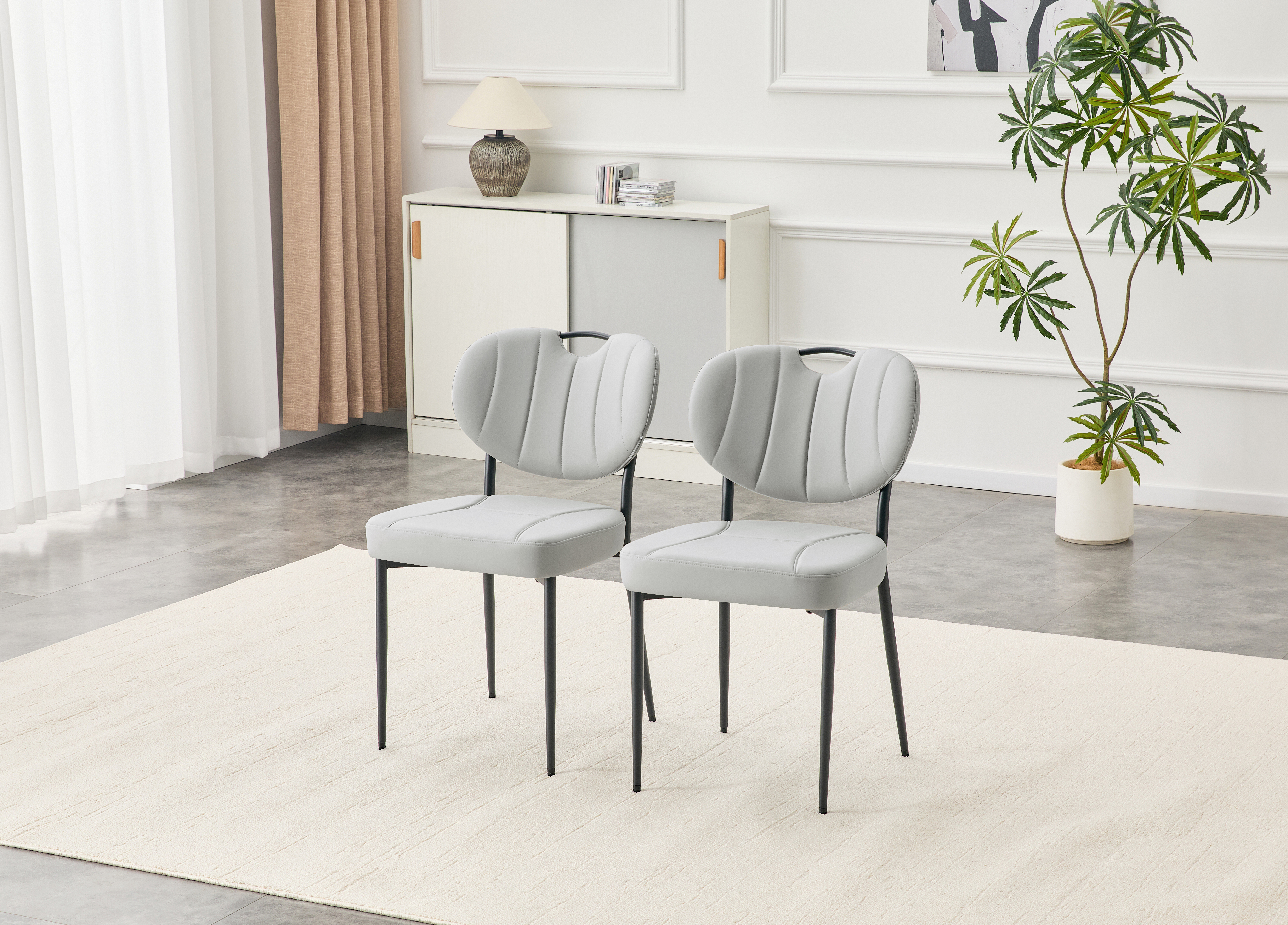 Sillas de comedor (juego de 2) tapizadas en cuero premium, patas de metal, gris.