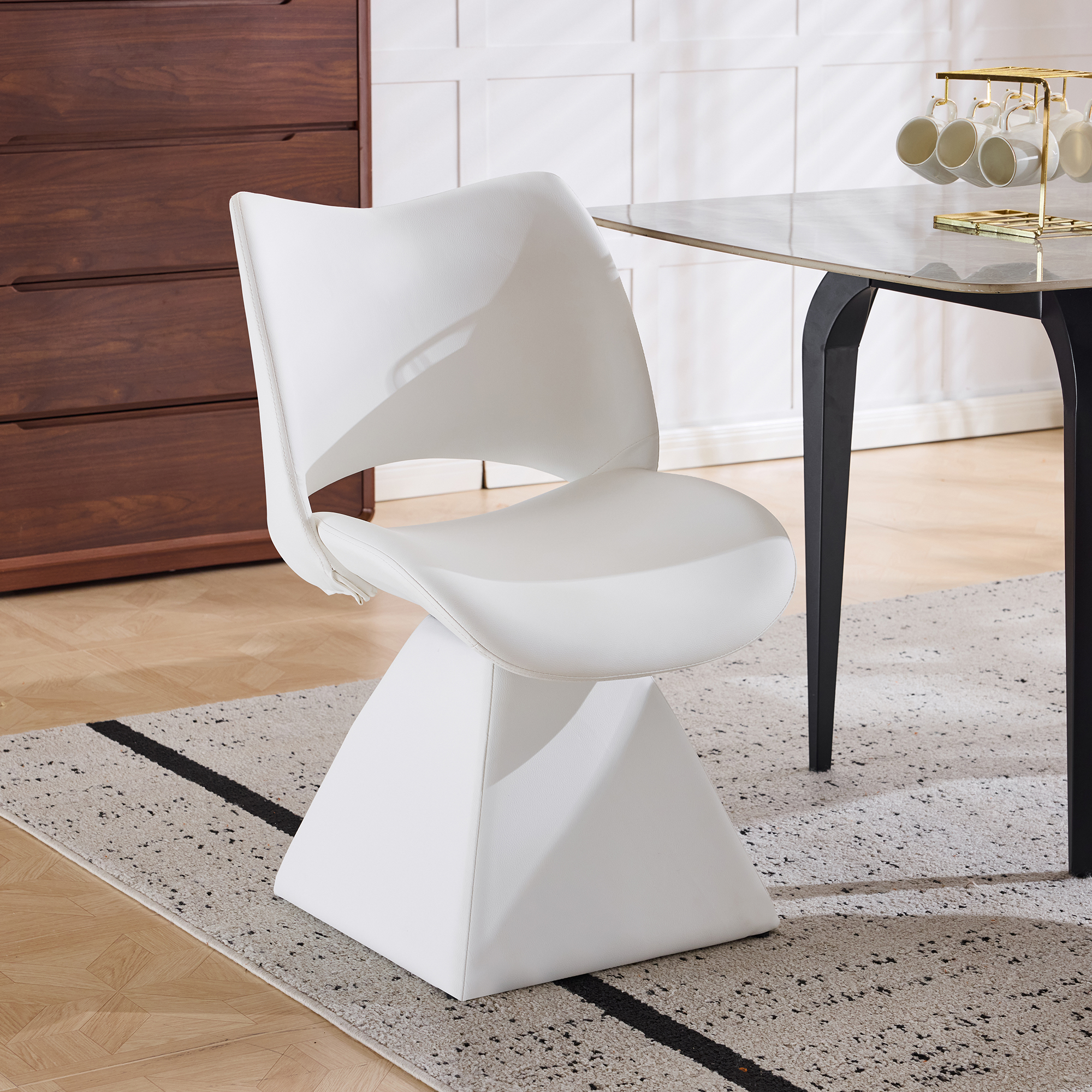 The swivel dining chair combines modern craftsmanship and can be combined in multiple sets. It is comfortable white artificial leather and upholstered modern high-backed tables and chairs.