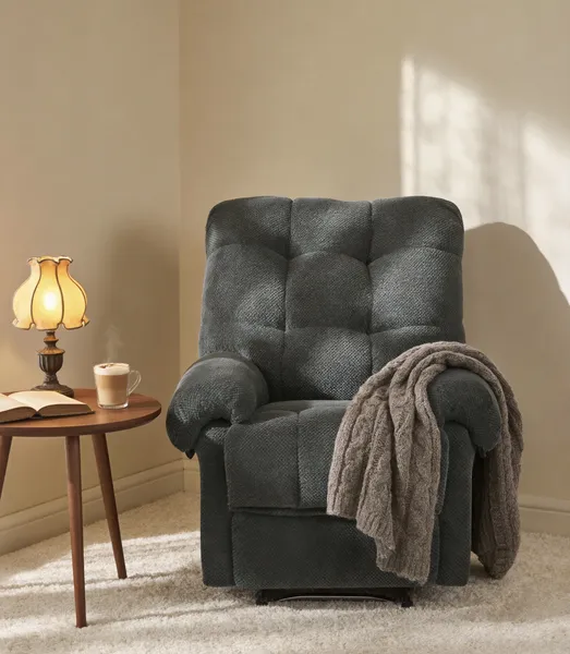 Sillón reclinable manual gris oscuro, tapizado suave con reposapiés acolchado.
